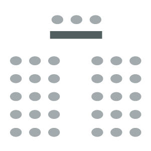 Room setup icon showing chairs in rows with speaker table and chairs at the front of the room