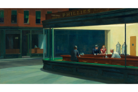 2 men and 1 woman in a restaurant being served